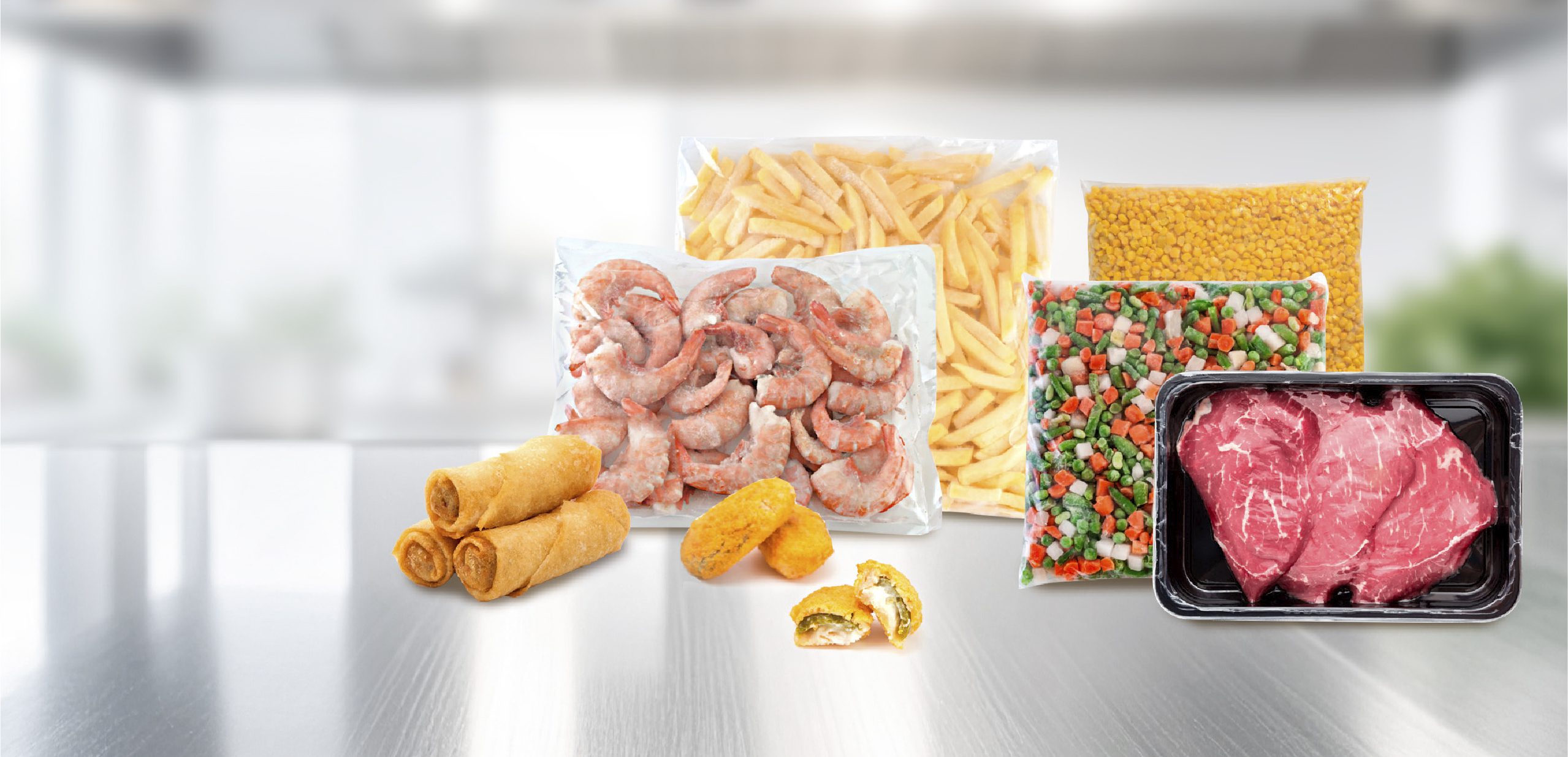 Assorted frozen foods including shrimp, steak, fries, veggies, corn, spring rolls, and stuffed jalapeños on a counter